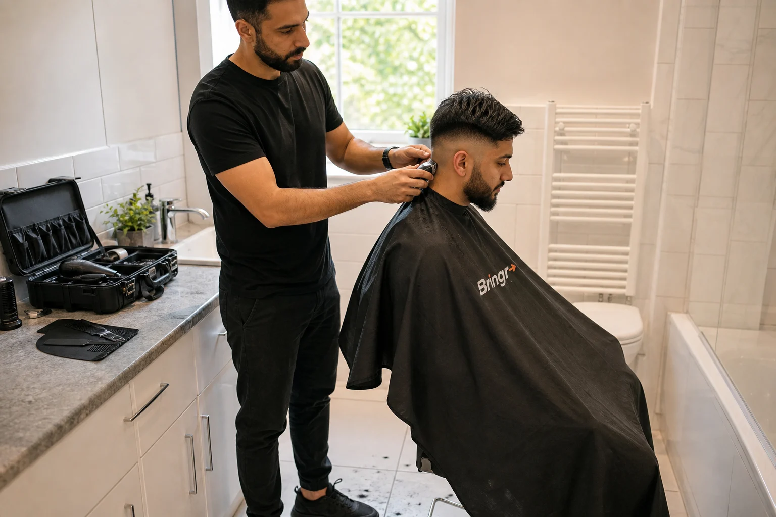 An independent barber giving a customer a haircut in a bright bathroom with tiled flooring